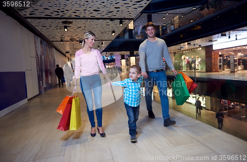 Image of young family with shopping bags