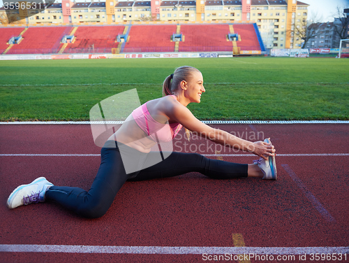 Image of sporty woman on athletic race track