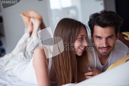 Image of couple relax and have fun in bed