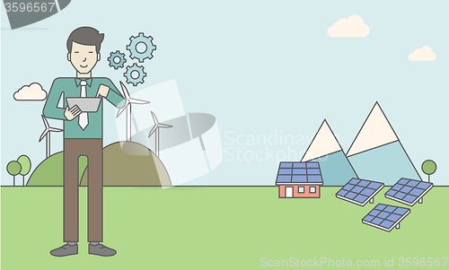 Image of Man with solar panels and wind turbines.