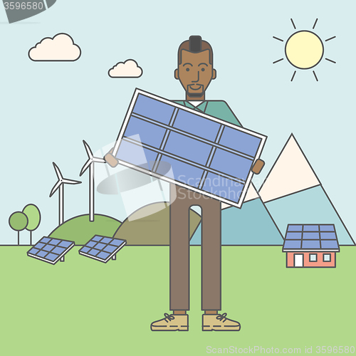 Image of Man with solar panels and wind turbines.