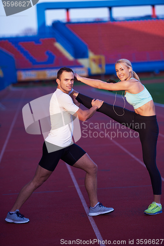 Image of sporty woman on athletic race track