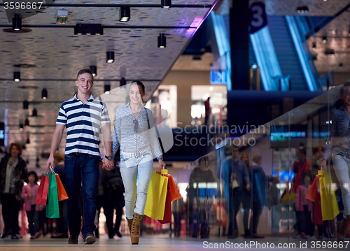 Image of young couple with shipping bags