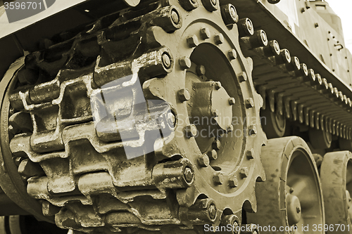 Image of Tracked military equipment close-up, toned