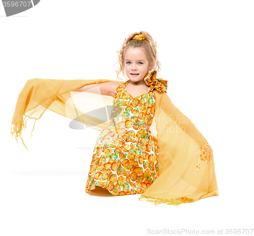 Image of Little Girl in a Yellow Dress with Shawl Posing