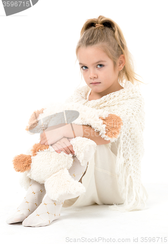 Image of Little Girl in a White Dress Posing
