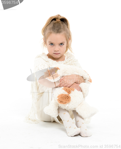 Image of Little Girl in a White Dress Posing