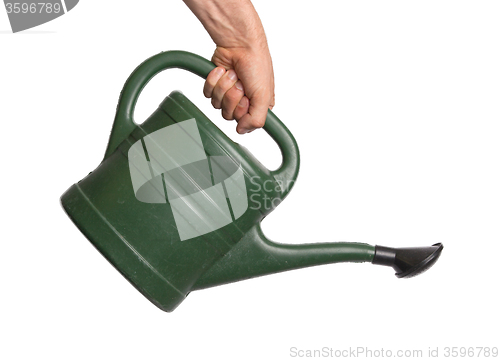Image of Hand holding green watering can