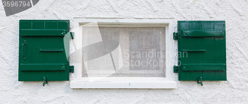 Image of Open wooden  green shutters