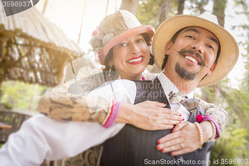 Image of 1920s Dressed Romantic Couple Flirting Outdoors