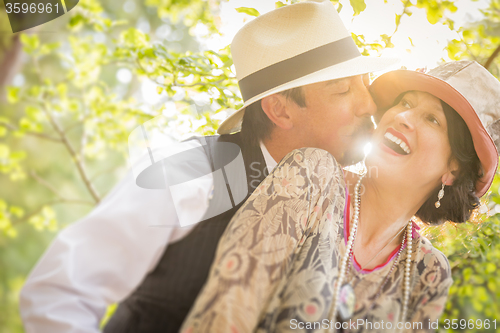 Image of 1920s Dressed Romantic Couple Flirting Outdoors