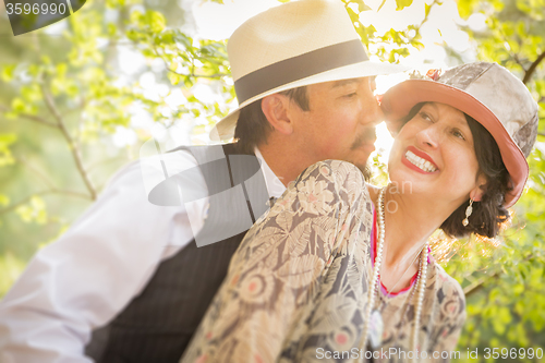 Image of 1920s Dressed Romantic Couple Flirting Outdoors