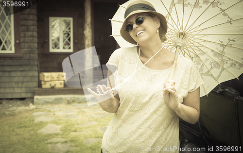 Image of 1920s Dressed Girl with Parasol Near Vintage Car Portrait