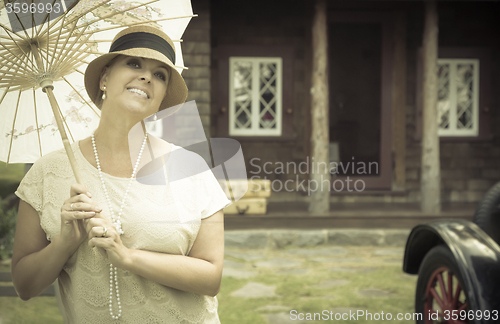 Image of 1920s Dressed Girl with Parasol Near Vintage Car Portrait