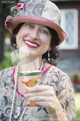 Image of 1920s Dressed Girl With Glass of Wine Portrait