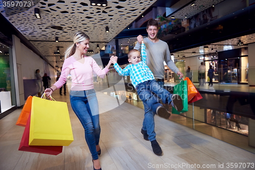 Image of young family with shopping bags