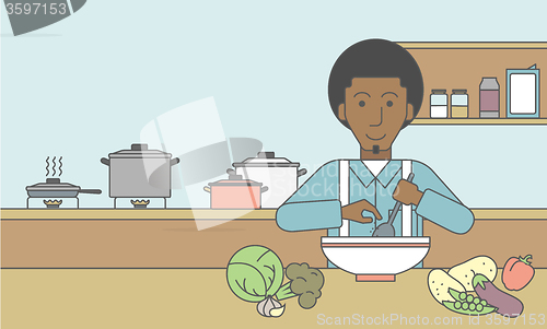 Image of Man cooking meal.