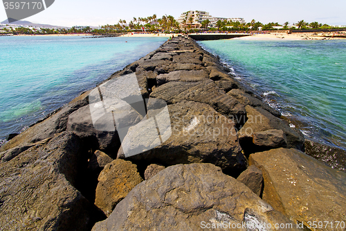 Image of white hotel  lanzarote  in spain   beach  stone  