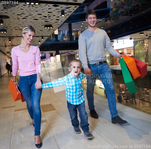Image of young family with shopping bags