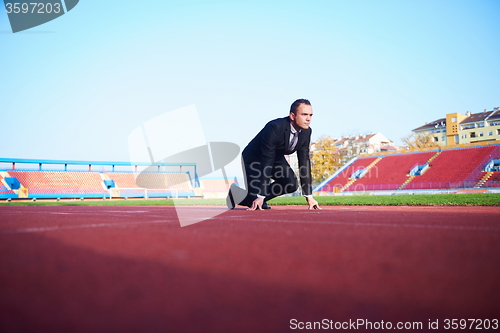 Image of business man ready to sprint