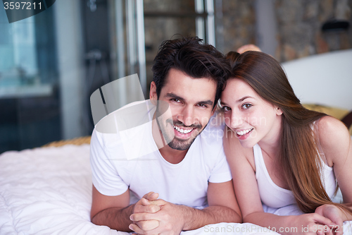 Image of couple relax and have fun in bed