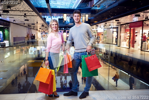 Image of young couple with shipping bags