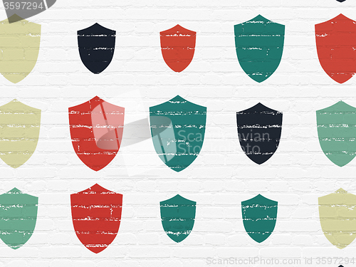 Image of Security concept: Shield icons on wall background
