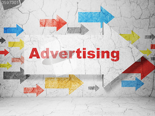 Image of Advertising concept: arrow with Advertising on grunge wall background