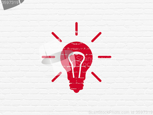 Image of Business concept: Light Bulb on wall background