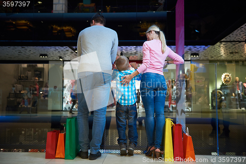 Image of young family with shopping bags