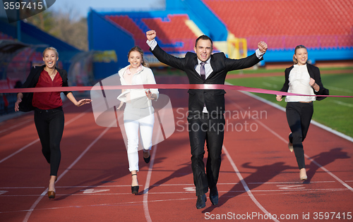 Image of business people running on racing track