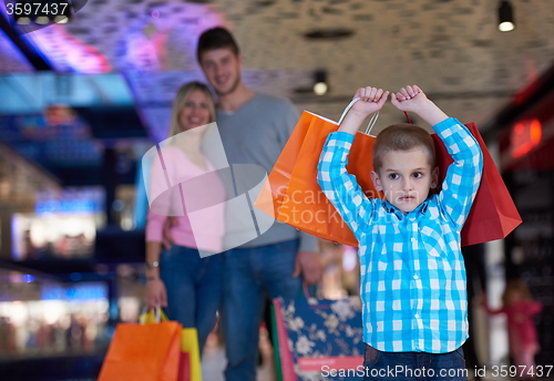 Image of young family with shopping bags