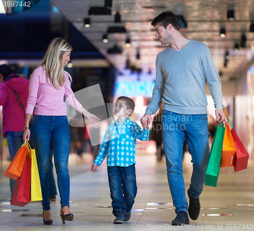 Image of young family with shopping bags