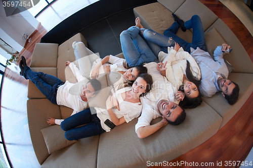 Image of friends group get relaxed at home