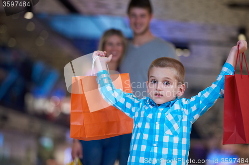 Image of young family with shopping bags