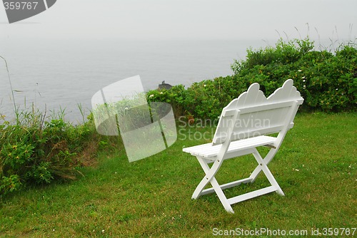 Image of Bench on ocean shore
