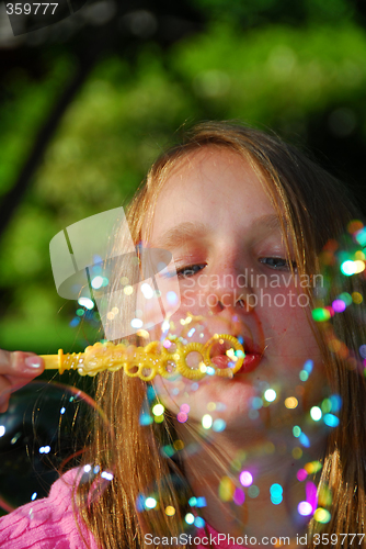 Image of Young girl soap bubbles