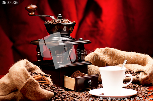 Image of Coffee grinder and cup