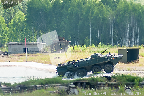 Image of BTR-82A armoured personnel carrier goes from water