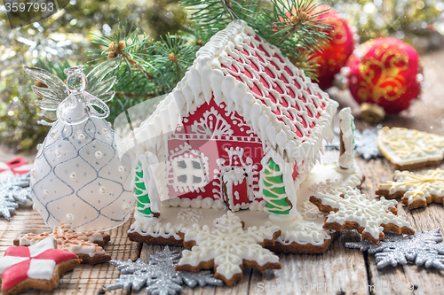 Image of Christmas angel and a gingerbread house.