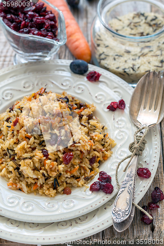 Image of Rice with carrots, raisins and cranberries.