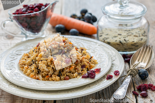 Image of Pilaf with raisins, carrots and cranberries.