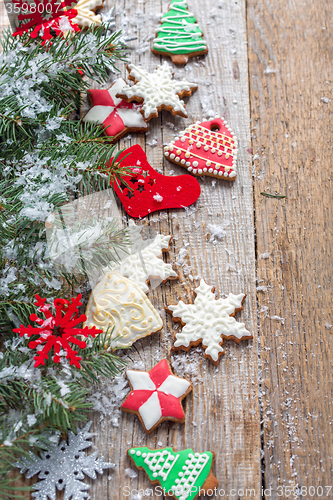 Image of Christmas cookies, decorations and spruce branches.