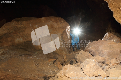 Image of speleologist in cave