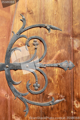 Image of medieval metal decorations on old door