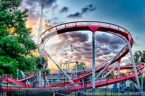 Image of crazy rollercoaster rides at amusement park