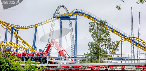 Image of crazy rollercoaster rides at amusement park