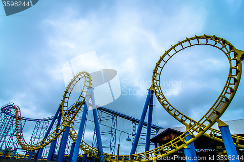 Image of crazy rollercoaster rides at amusement park