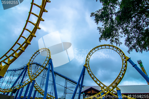 Image of crazy rollercoaster rides at amusement park