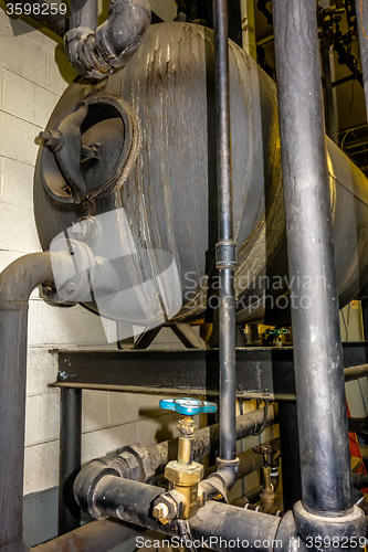 Image of old boiler room equipment- high power boiler burner